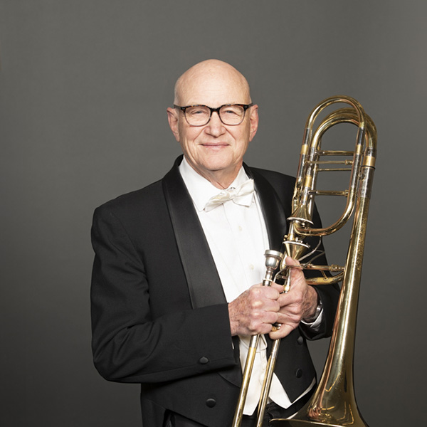 A portrait of Kurt Patzner and his instrument