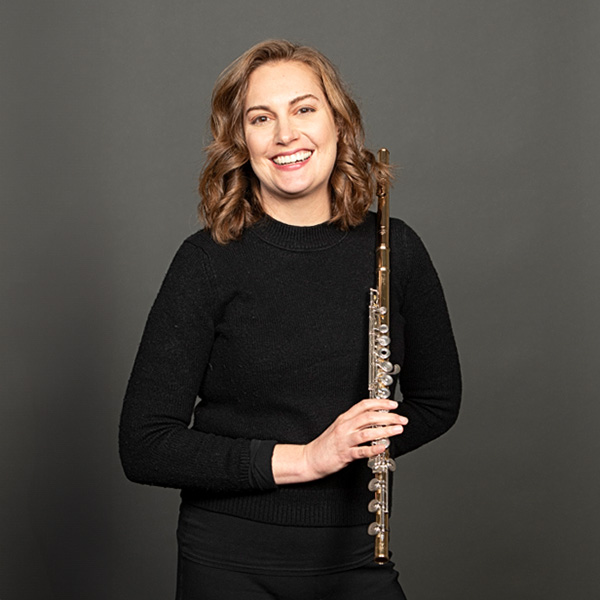 A portrait of Carmen Lemoine and her flute
