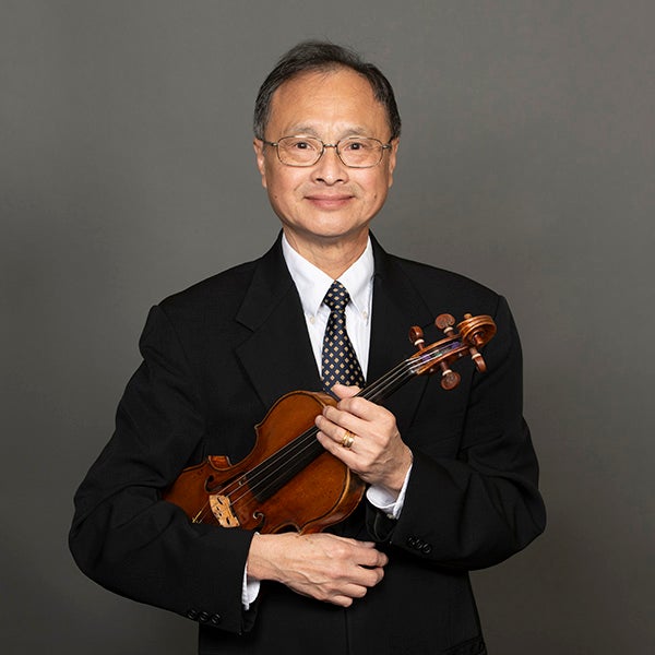 A portrait of Edmond Fong and his violin