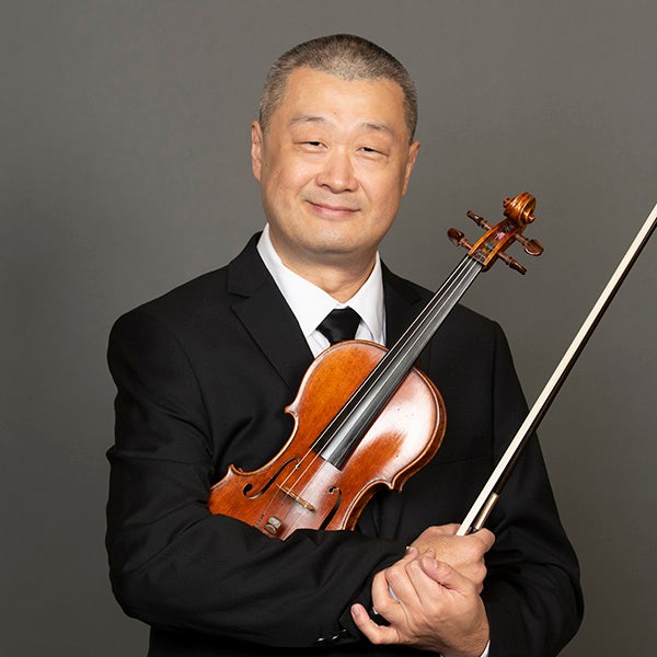 A portrait of Jay Zhong and his violin