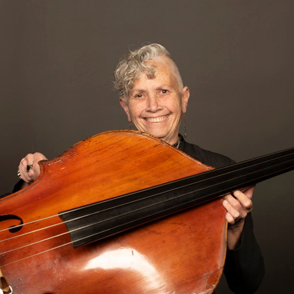 A portrait of Karen Zimmerman andher instrument