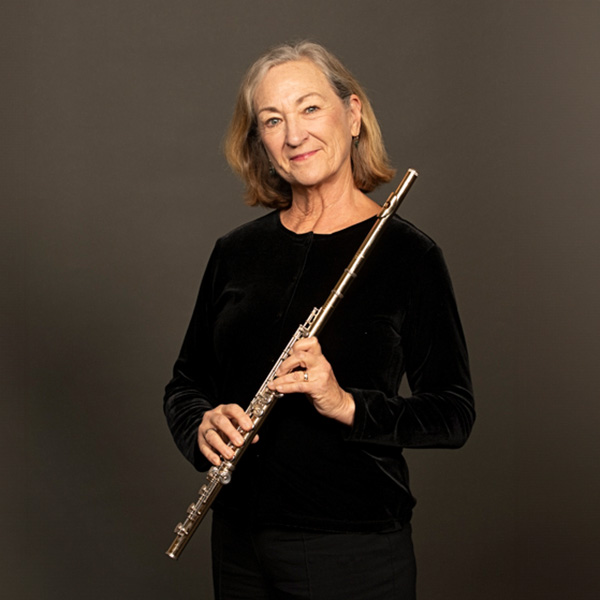 A portrait of Kathleen Reynolds and her instrument