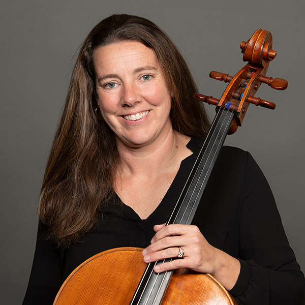 A portrait of Kelly Maulbetsch and her instrument