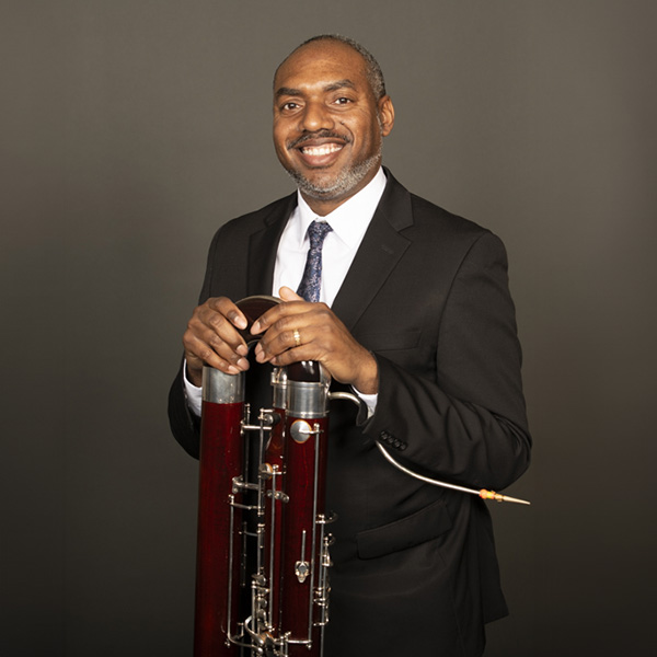Portrait of Shawn Jones and his bassoon