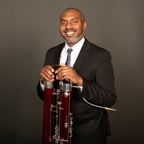 Portrait of Shawn Jones and his bassoon