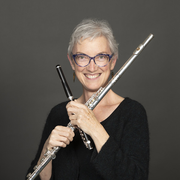 A portrait of Stacey Pelinka and her instruments