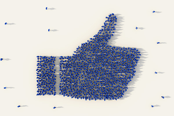 Large group of people forming a thumb up icon in business, like button in social media