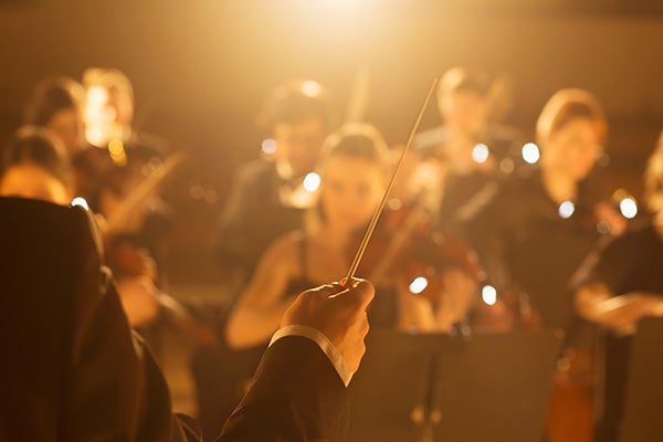 Conductor leading orchestra