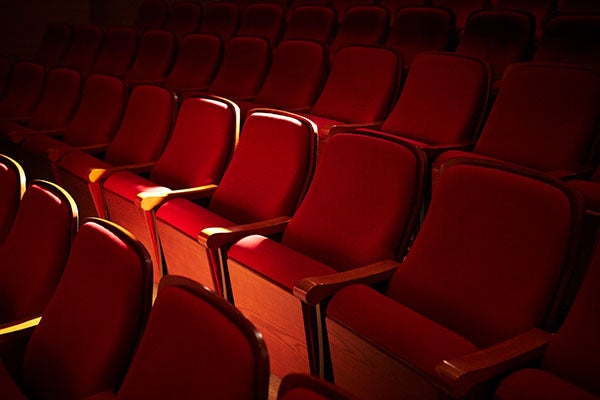 Rows of red seats in a concert hall.