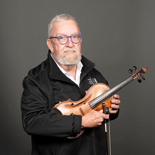 A portrait of Bob Williams and his instrument