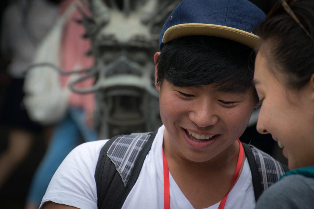 smiling man with a hat on