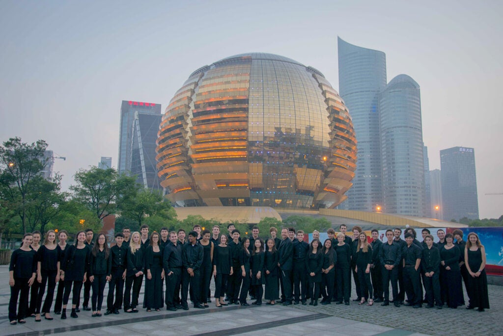 The students in front of a beautiful building