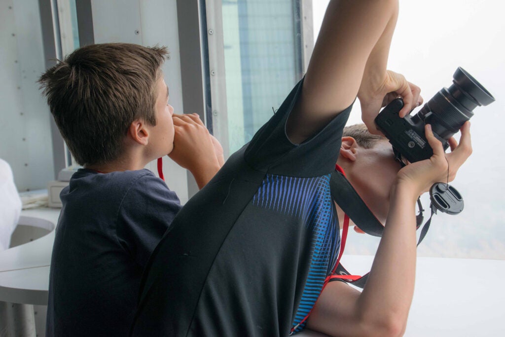 A young person taking a picture with a dslr