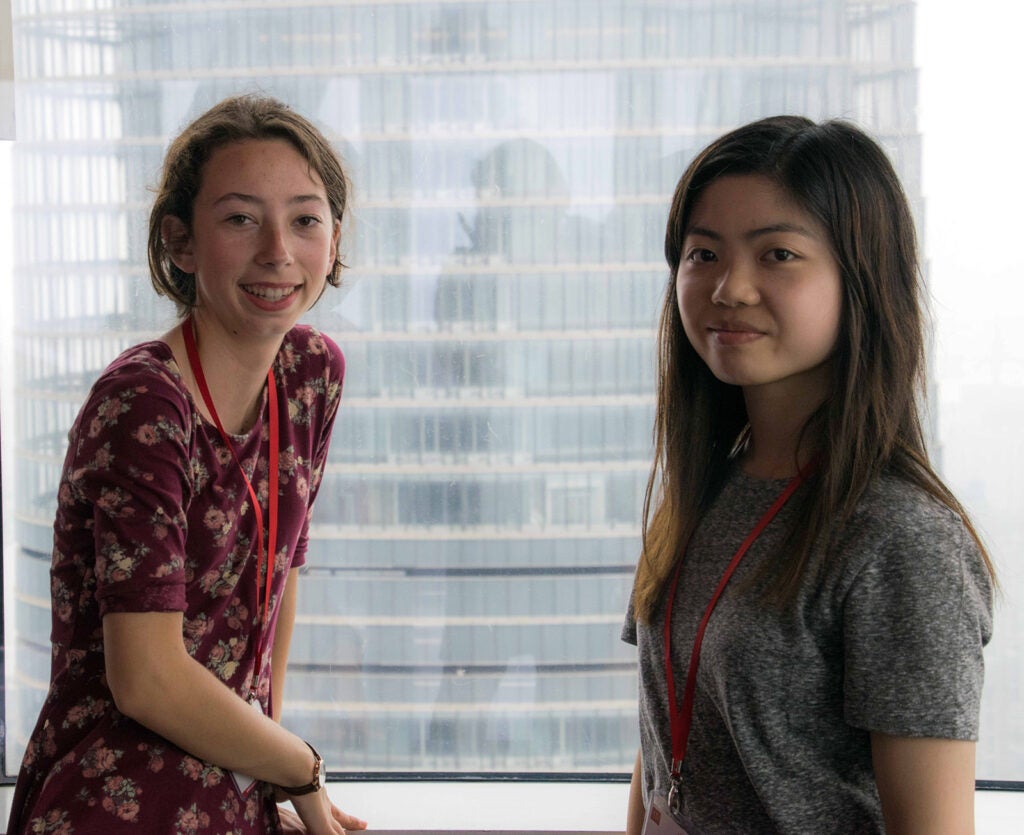 Two young students smiling for the camera