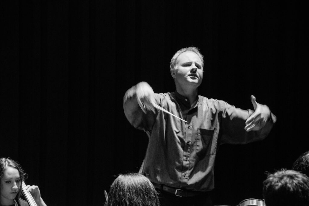 A conductor, conducting