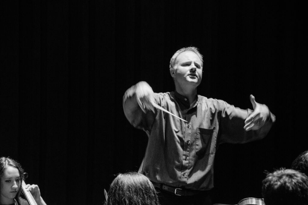 A conductor, conducting