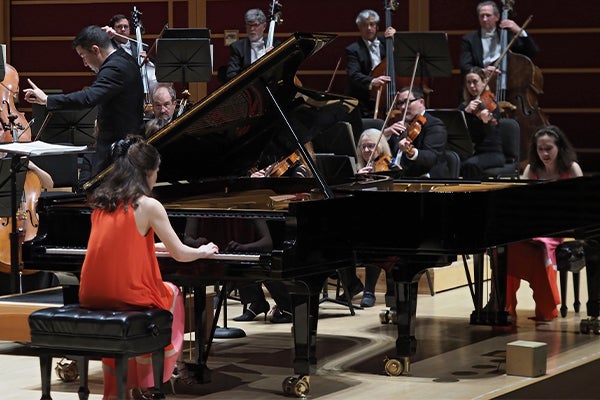 The Naughton sisters playing piano