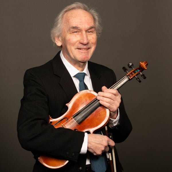 A portrait of Zinovy Zelichenok and his instrument