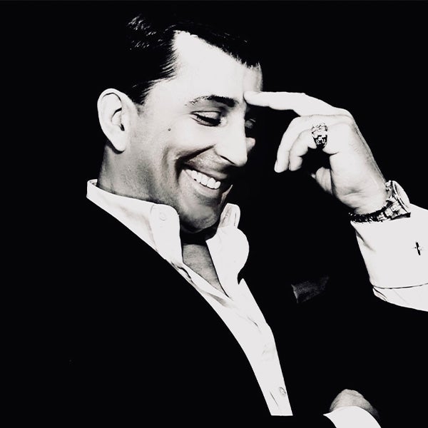 A black and white portrait of Chris Jason