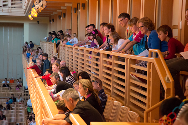 Audience members enjoying the orchestra