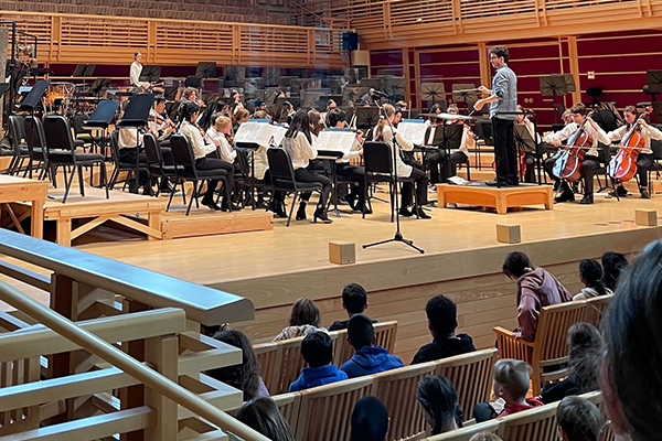 Youth orchestra performing on stage