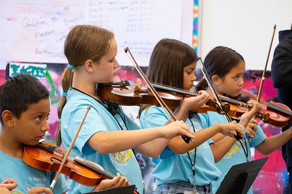 Summer Music Academy students playing violin